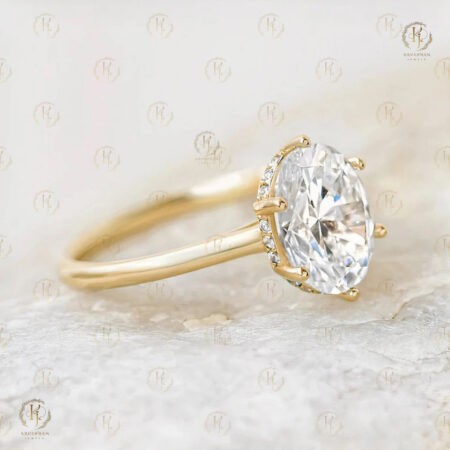 Big Oval diamond on Middle and yellow tone Ring